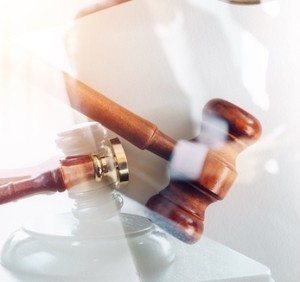 A judge's gavel on a white background.