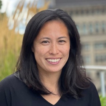 A photo of a person in a black shirt.