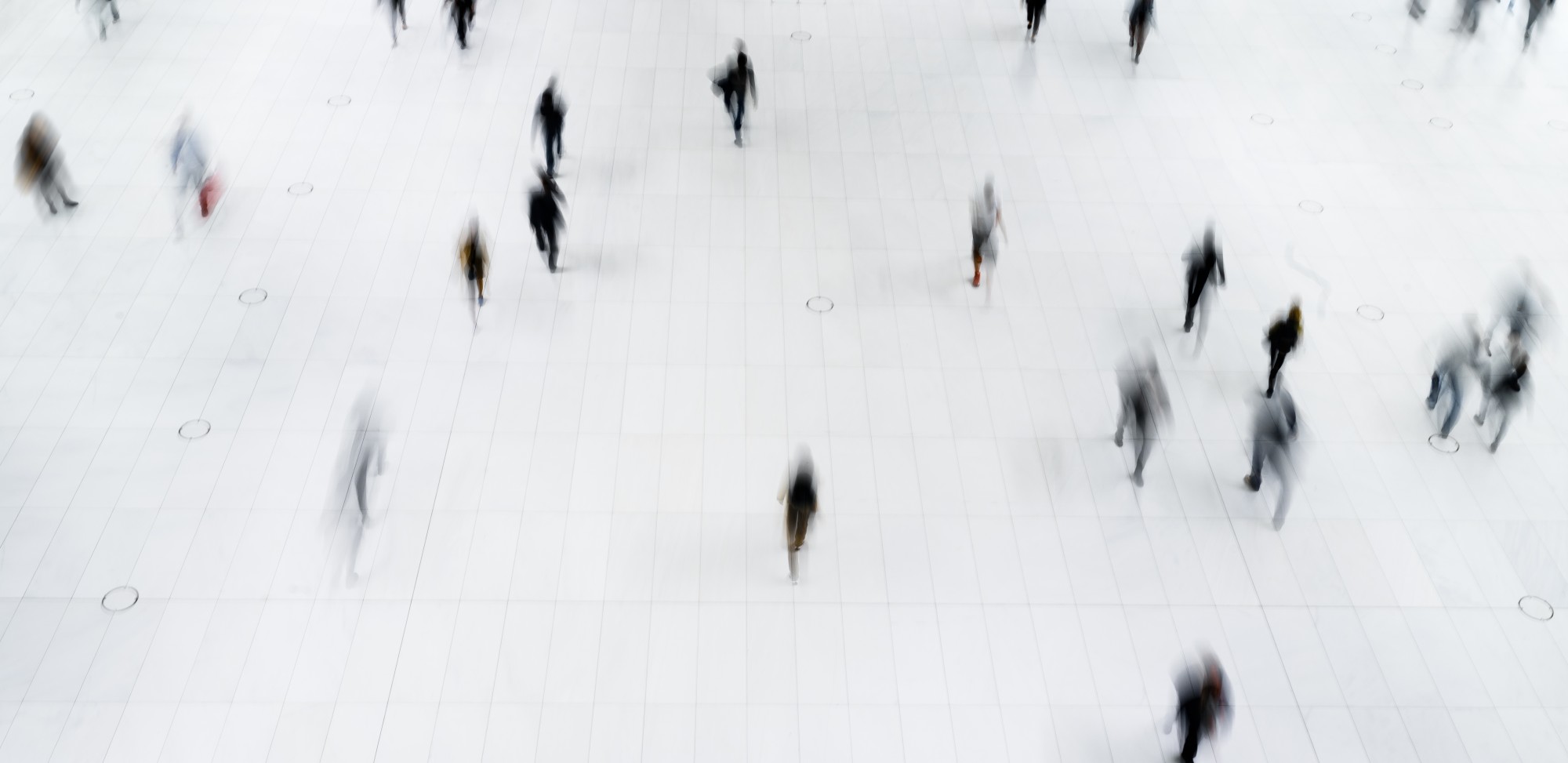 A blurred photo of people walking.