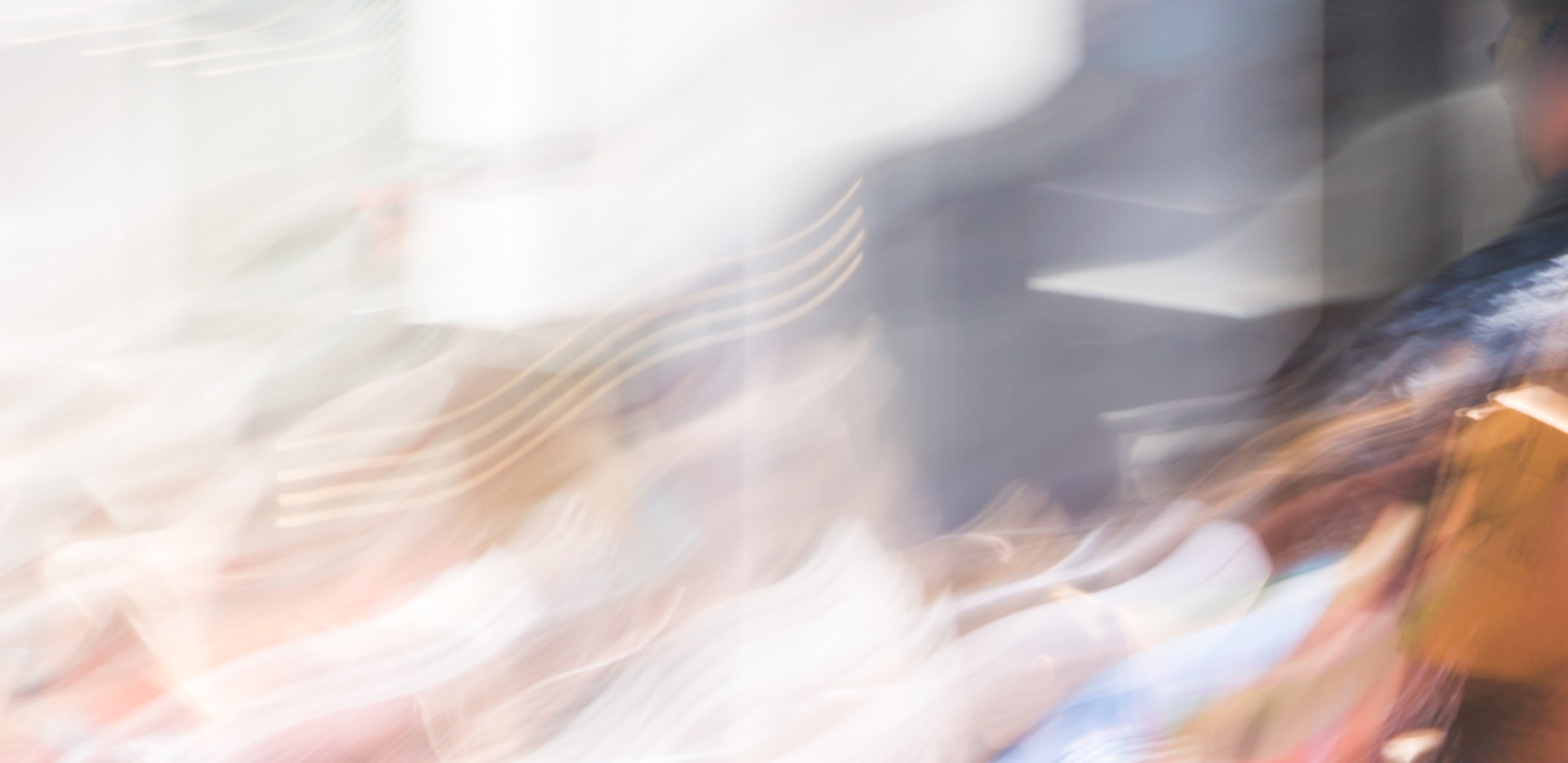 A blurred photo of people walking.