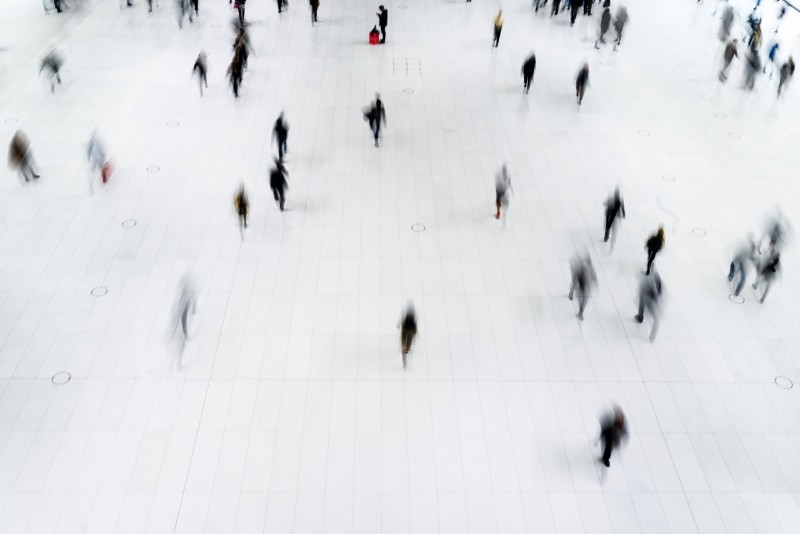 A blurred photo of people walking.