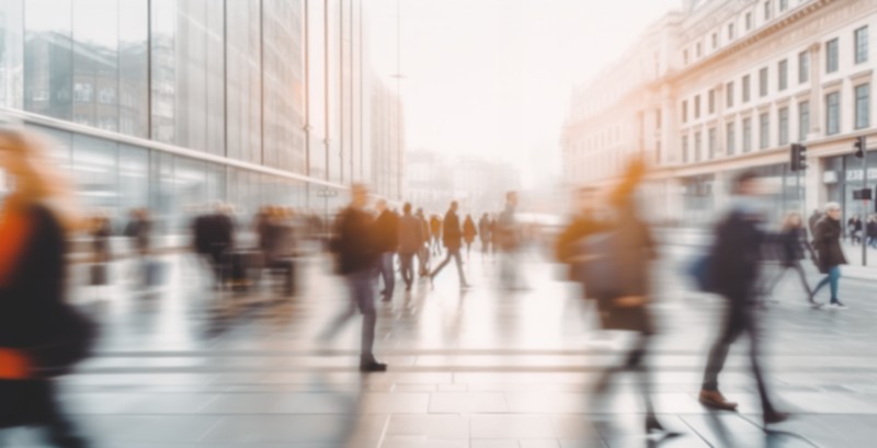 A blurred photo of people walking.