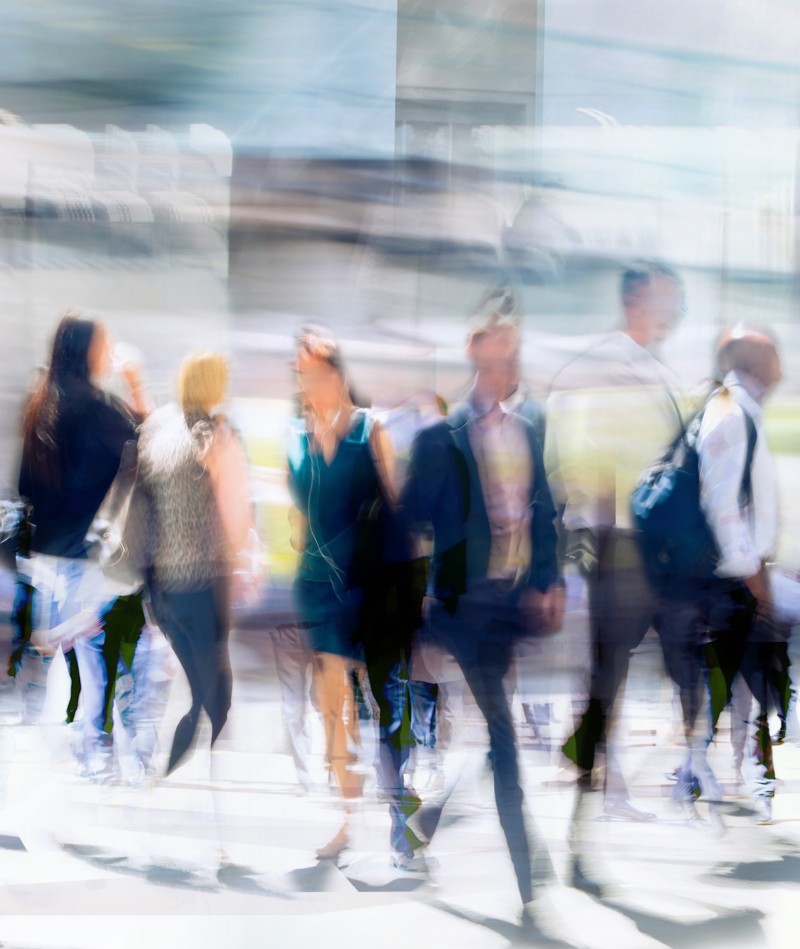A blurred photo of people walking.