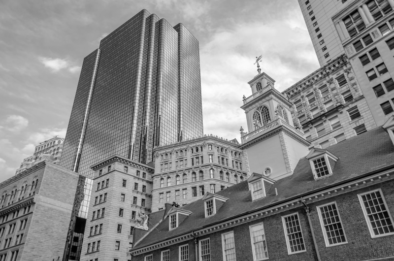 A black and white photo of the old Boston State house.