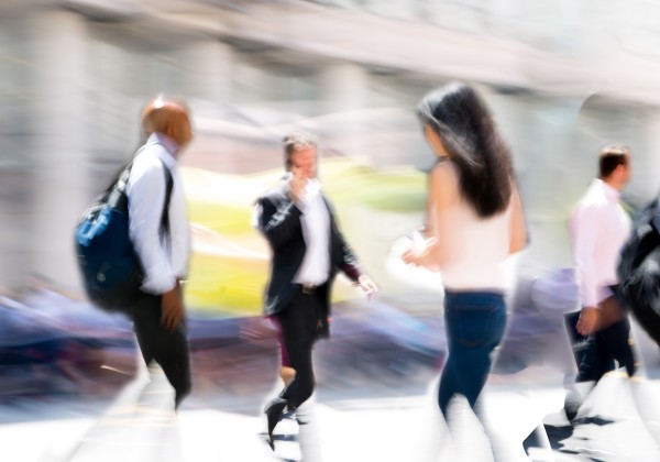A blurred photo of people walking.