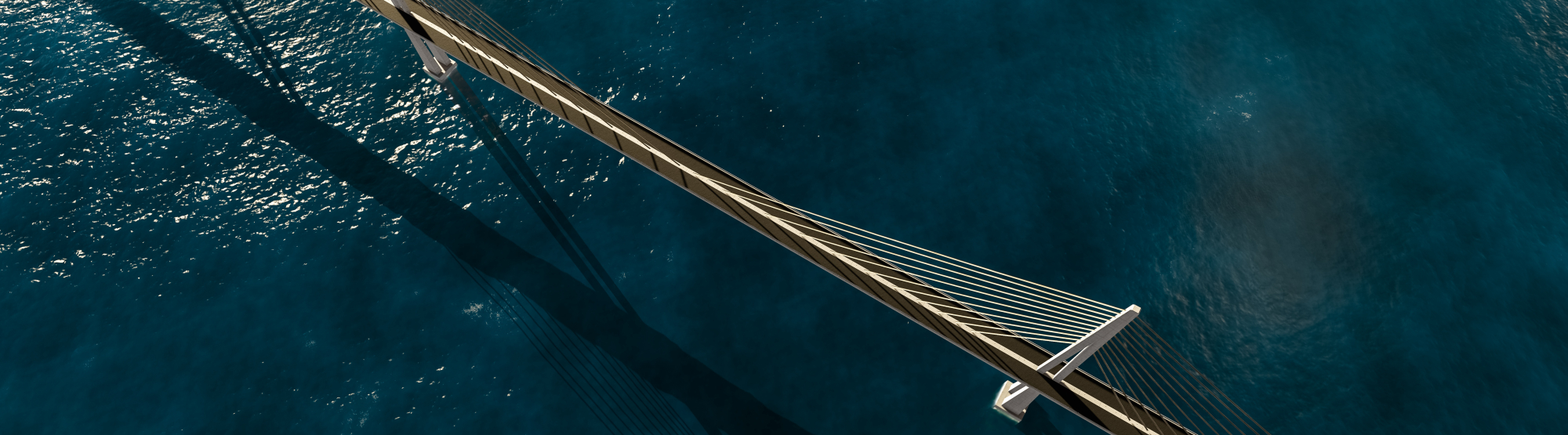A bird's eye view of a bridge over the sea.