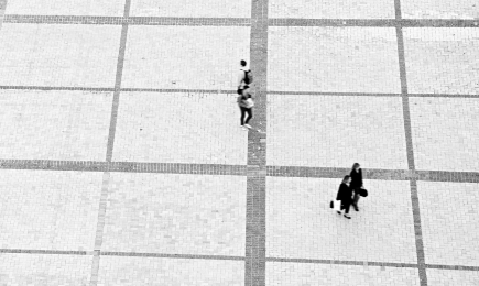 An arial photo of people walking in pairs.
