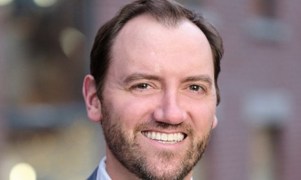 A photo of a person wearing a suit.