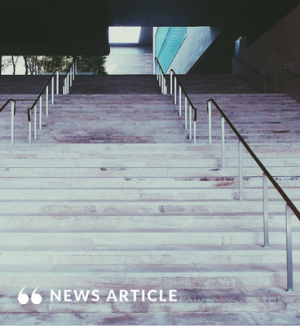 Concrete stairs with a railing.