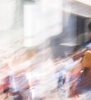 A blurred photo of people walking.